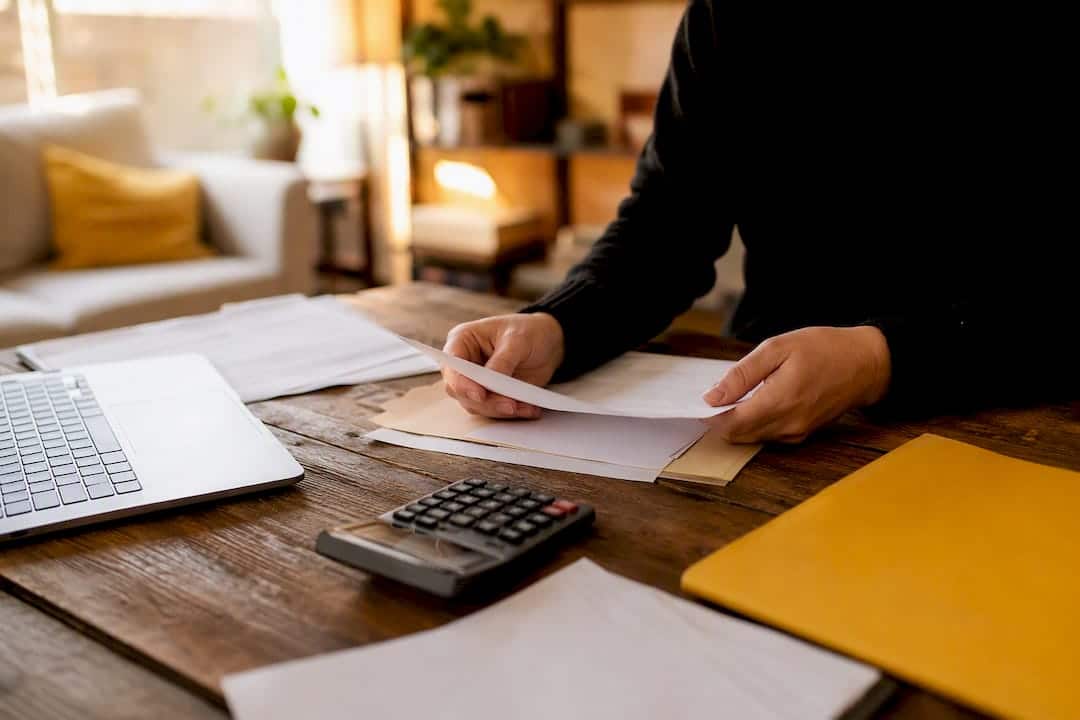Hands gathering wage evidence items