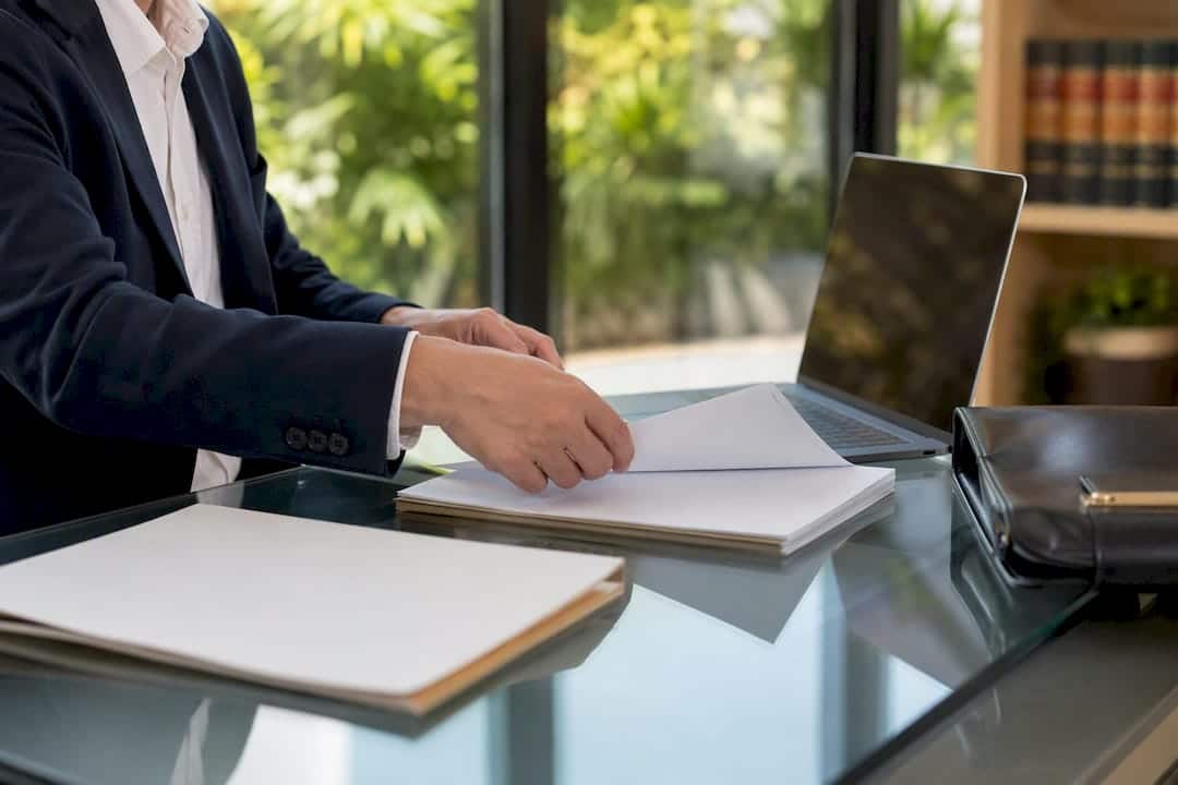 Lawyer's hands preparing legal case evidence