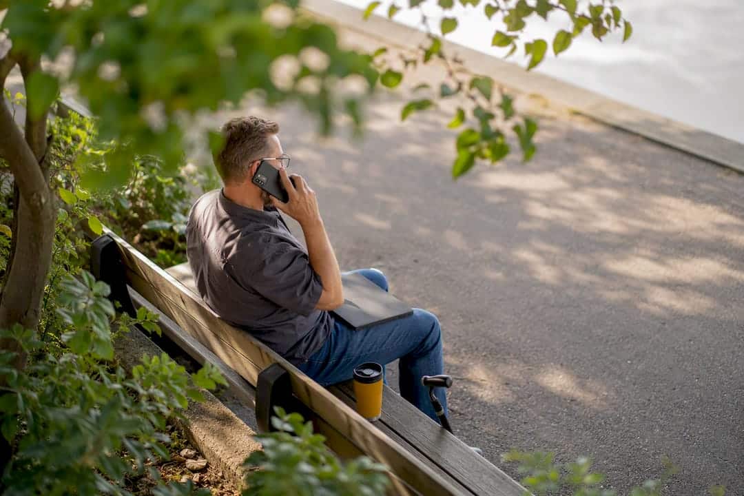 Person with disability making a call outside