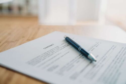Contract on the desk with a pen